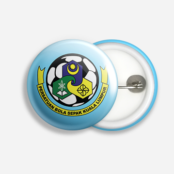 A blue button badge with a football design overlaid with several symbols, and labelled “Persatuan Bola Sepak Kuala Lumpur”.