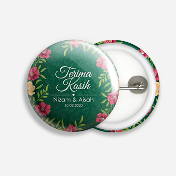 A button badge that say “Terima Kasih” with a floral border design and a green background.