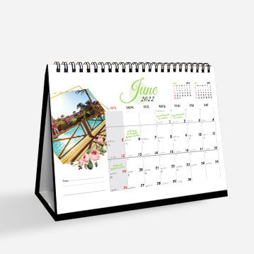 A simple hard stand desk calendar featuring an image of a body of water on a white background.