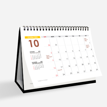A simple hard stand desk calendar on a white background.