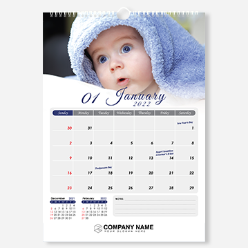 A simple wire-O bound wall calendar featuring an image of a baby making a curious expression.