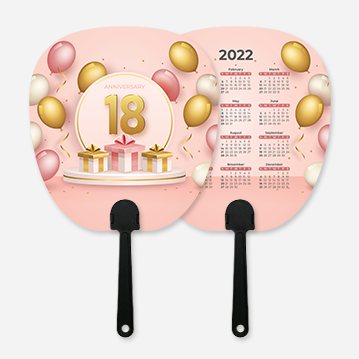 A simple hand fan printed with a pink design featuring balloons and gift boxes, as well as text that says “Anniversary 18”. The other side features a 2022 calendar.
