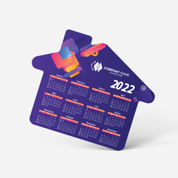A magnet shaped like a house with a chimney, featuring a dark blue design with a 2022 calendar.