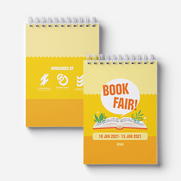 Two wirebound notebooks are arranged side by side, both highlighting a book fair.